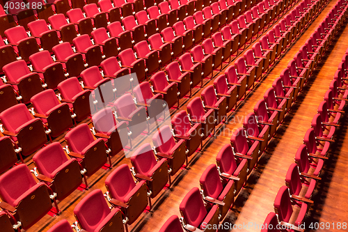 Image of Red color theatre chair in conference room.