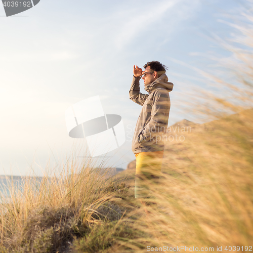 Image of Free active man enjoying beauty of nature.