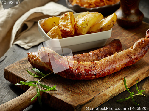 Image of grilled sausages and potatoes