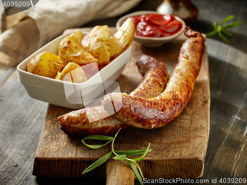 Image of grilled sausages and potatoes