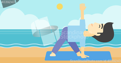 Image of Man practicing yoga triangle pose on the beach.