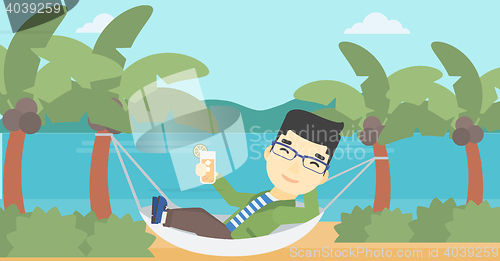 Image of Man chilling in hammock with cocktail.