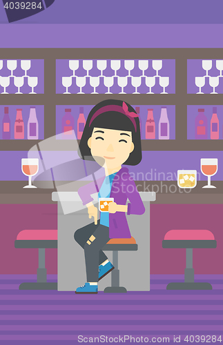 Image of Woman sitting at the bar counter.