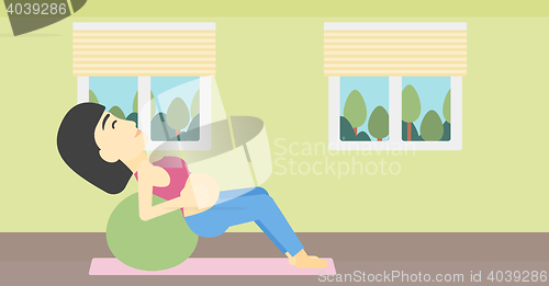 Image of Pregnant woman on gymnastic ball.