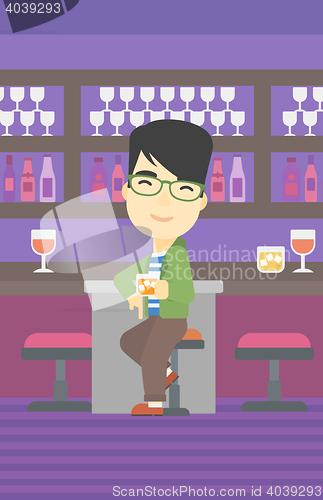 Image of Man sitting at the bar counter.