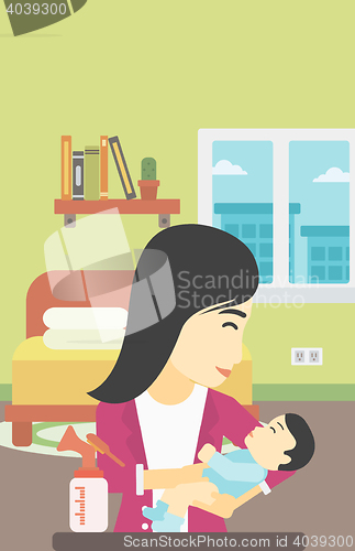 Image of Mother with baby and breast pump.