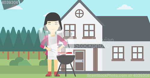 Image of Woman cooking meat on barbecue grill.