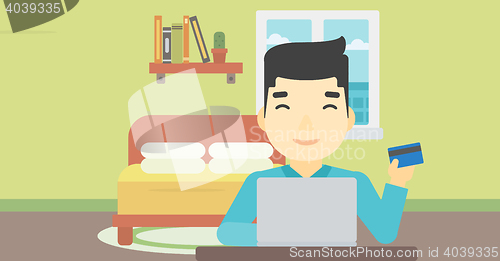 Image of Man shopping online using his laptop.