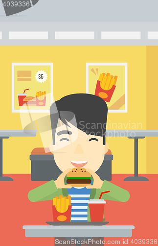 Image of Man eating hamburger vector illustration.