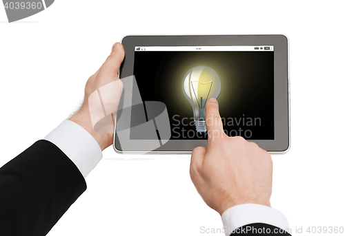 Image of close up of man hands holding tablet pc