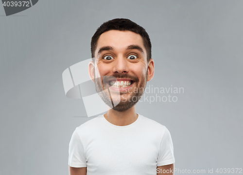 Image of man with funny face over gray background