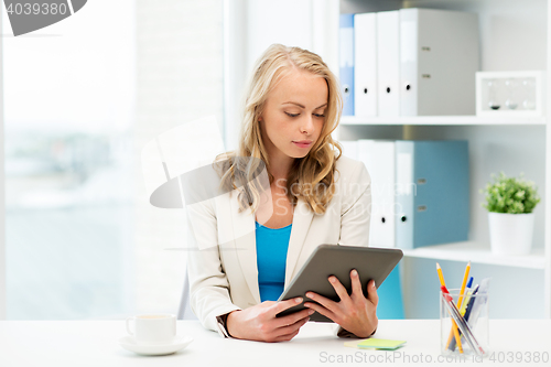 Image of businesswoman or student with tablet pc at office