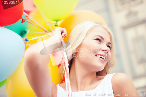 Image of woman with colorful balloons