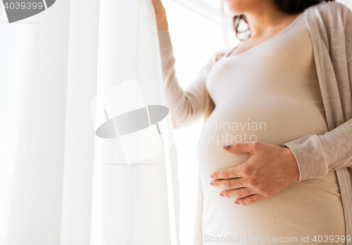 Image of close up of pregnant woman with big belly