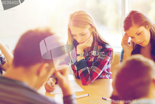 Image of group of students with papers