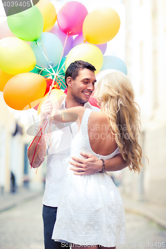 Image of couple with colorful balloons