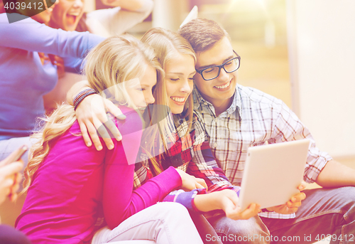 Image of group of smiling students with tablet pc