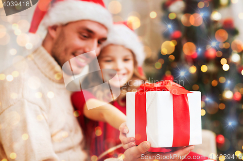 Image of close up of father and daughter with gift box