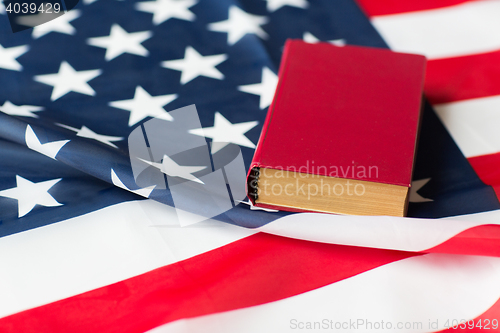 Image of close up of american flag and book