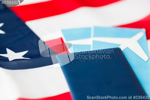 Image of american flag, passport and air tickets