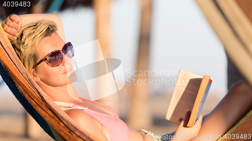 Image of relaxed woman laying in hammock