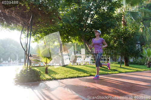 Image of sporty woman jogging