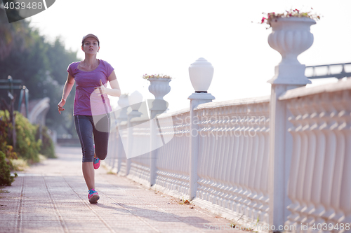 Image of sporty woman jogging