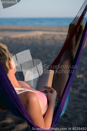 Image of relaxed woman laying in hammock