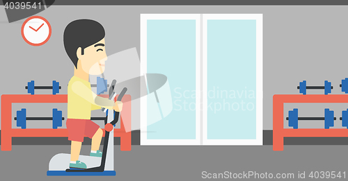 Image of Man exercising on elliptical trainer.