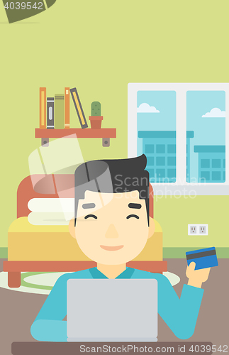 Image of Man shopping online using his laptop.
