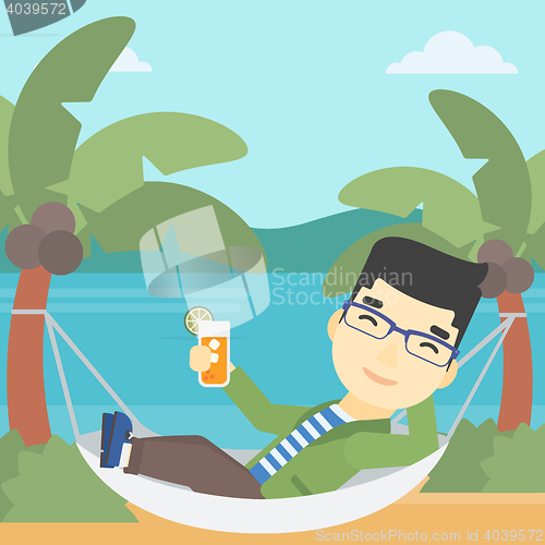 Image of Man chilling in hammock with cocktail.