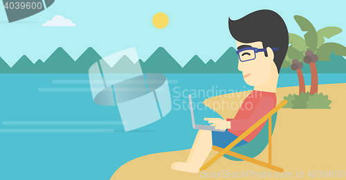 Image of Businessman working on laptop on the beach.