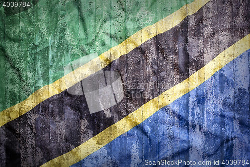 Image of Grunge style of Tanzania flag on a brick wall     