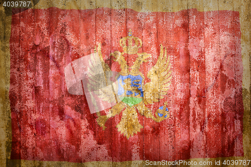 Image of Grunge style of Montenegro flag on a brick wall     