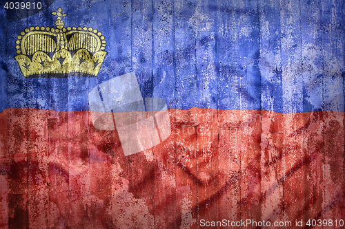 Image of Grunge style of Liechtenstein flag on a brick wall