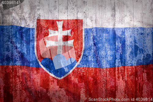 Image of Grunge style of Slovakia flag on a brick wall