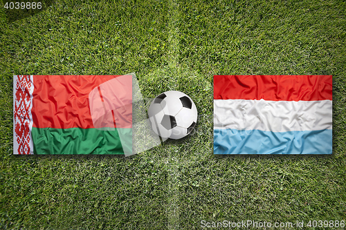 Image of Belarus vs. Luxembourg flags on soccer field