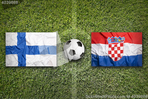 Image of Finland vs. Croatia flags on soccer field