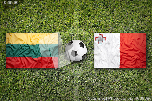 Image of Lithuania vs. Malta flags on soccer field