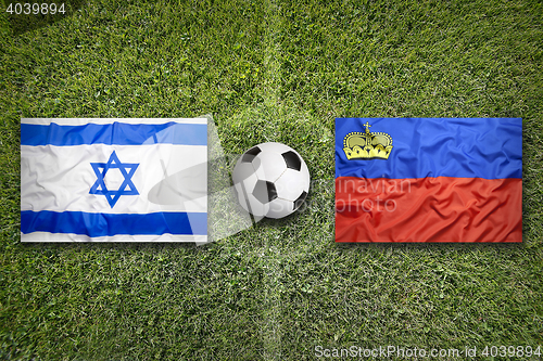 Image of Israel vs. Liechtenstein flags on soccer field