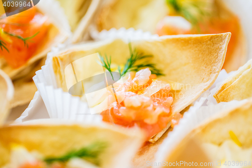Image of close up of dough cornet with salmon fish filling