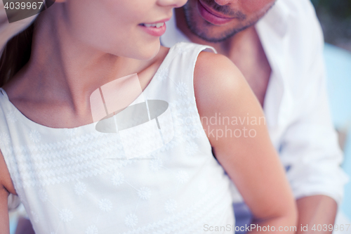 Image of couple in shades at sea side