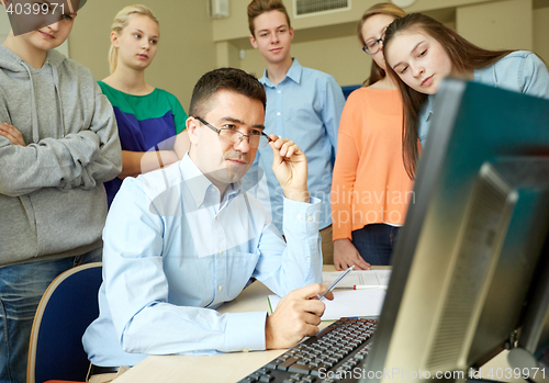 Image of group of students and teacher at school classroom