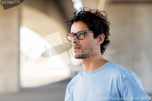 Image of man in eyeglasses on city street