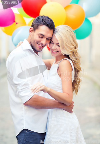 Image of couple with colorful balloons