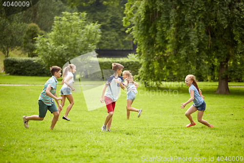 Image of happy kids running and playing game outdoors