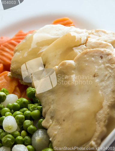 Image of sliced white meat chicken dinner and vegetables