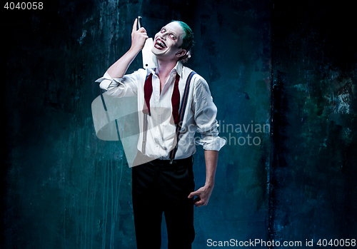 Image of Bloody Halloween theme: crazy joker face