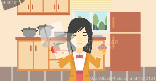 Image of Woman choosing between apple and cupcake.