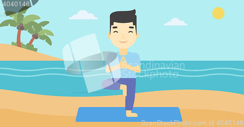 Image of Man practicing yoga tree pose on the beach.